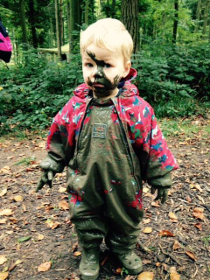 Muddy child enjoying themselves